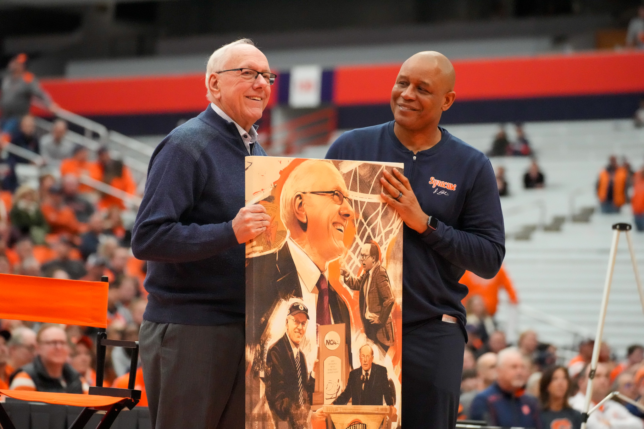 Jim Boeheim receives a gift from his former Syracuse basketball assistant, HC Adrian Autry. (Photo credit: Jonathan Kinane)
