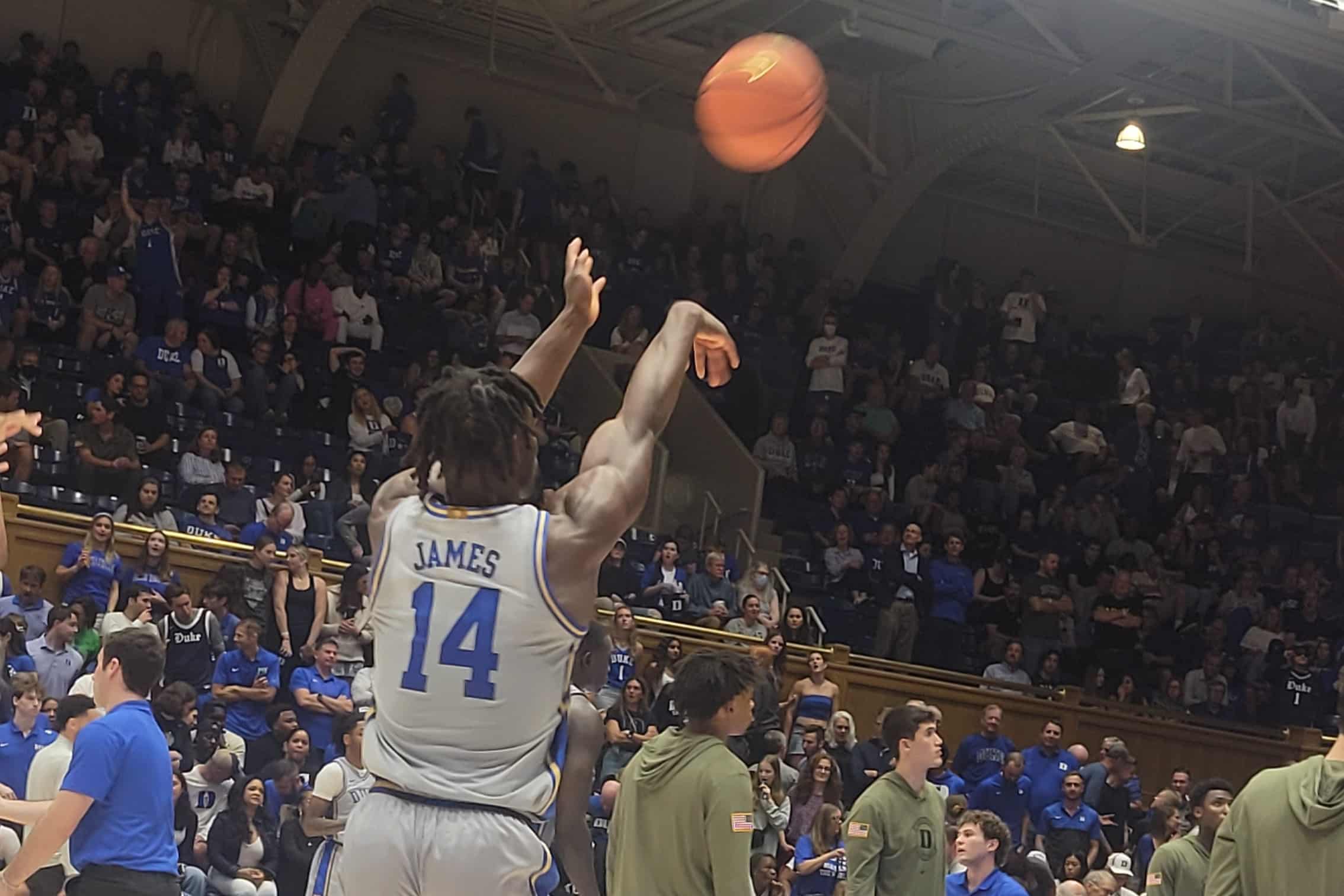 Duke basketball player Sion James (14) warms up during halftime.