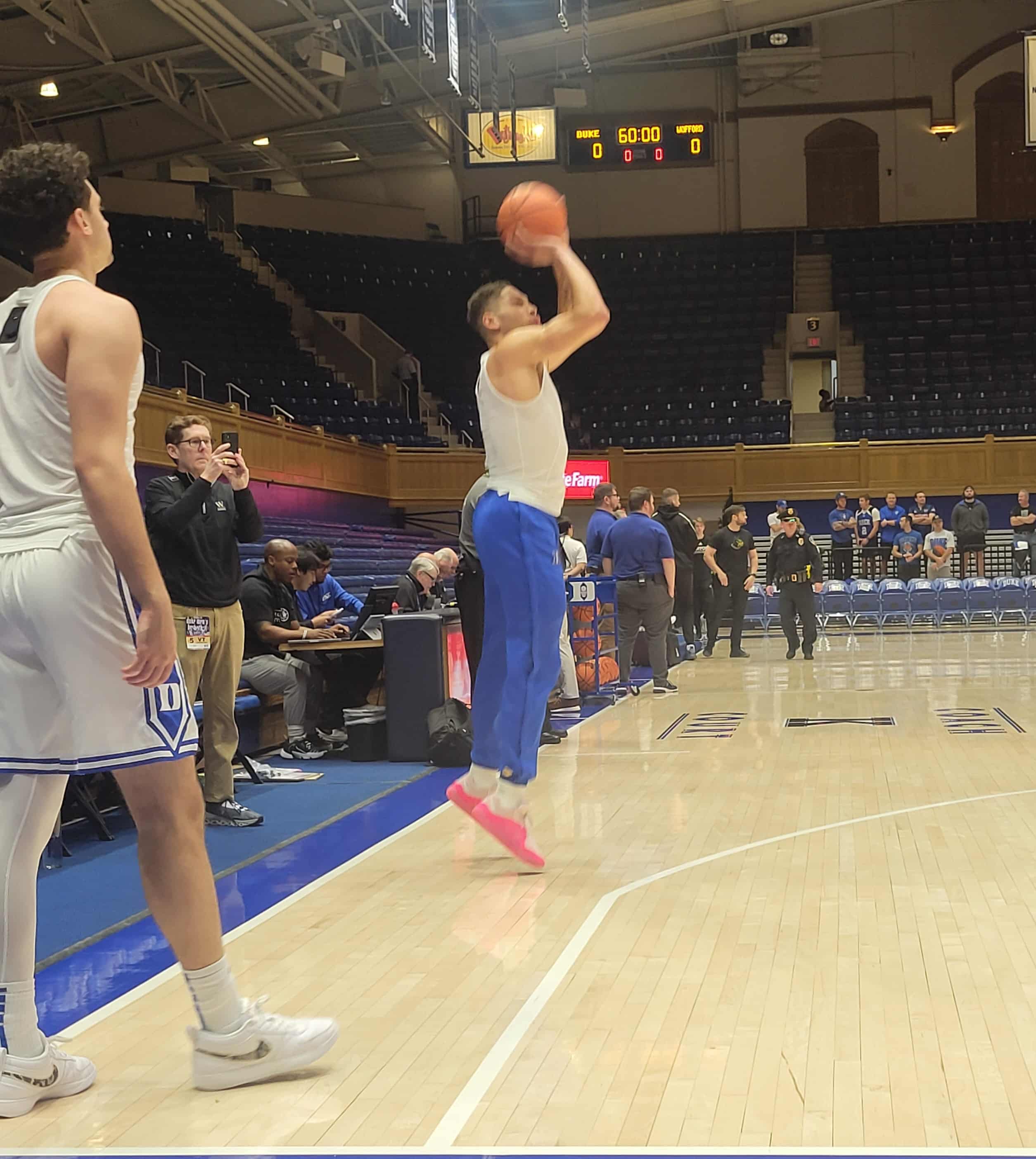 Duke basketball player Mason Gillis warms up prior to game against Wofford