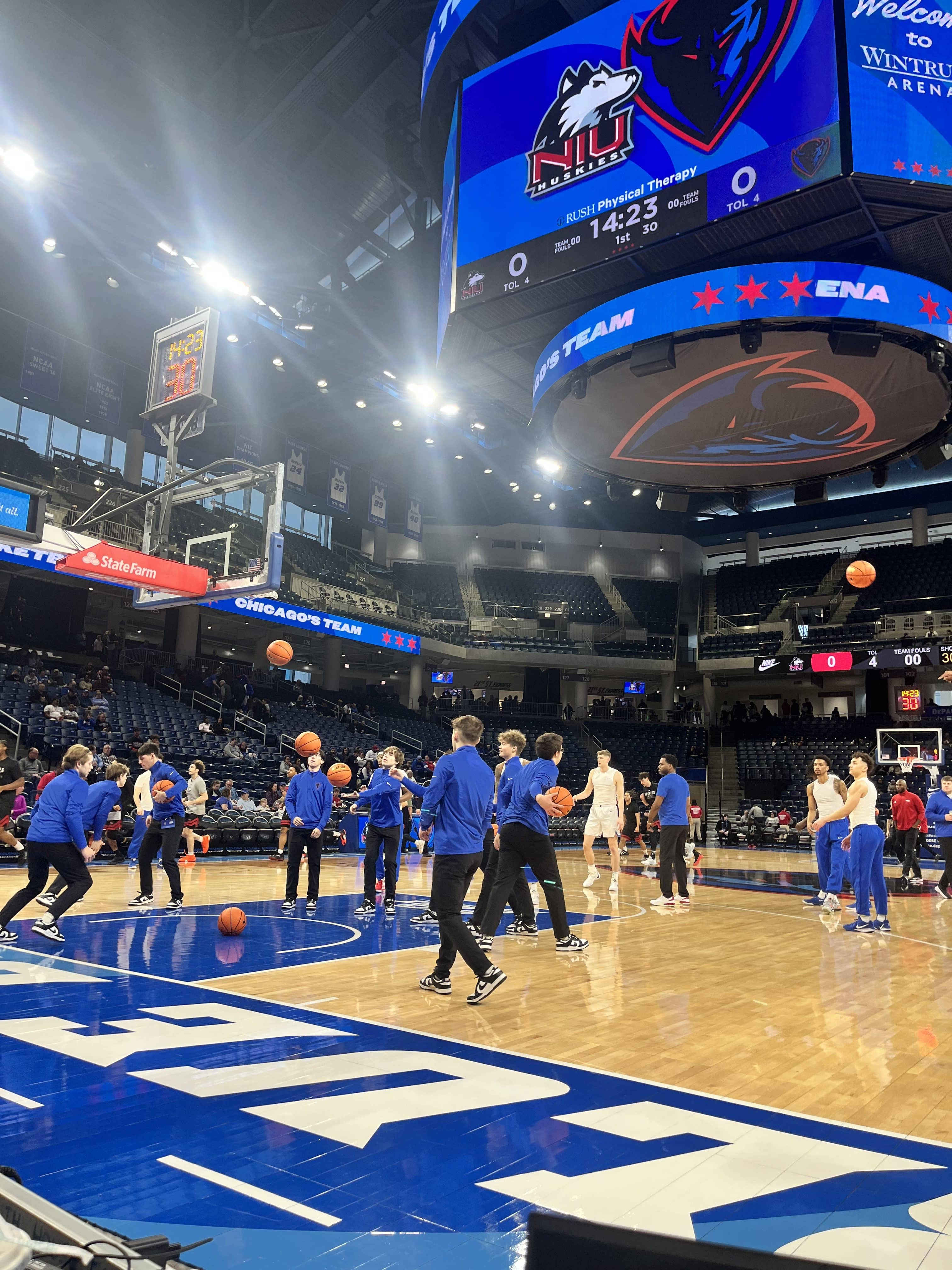 DePaul basketball players David Skogman, Jacob Meyer, and CJ Gunn warmup before their victory over the NIU Huskies