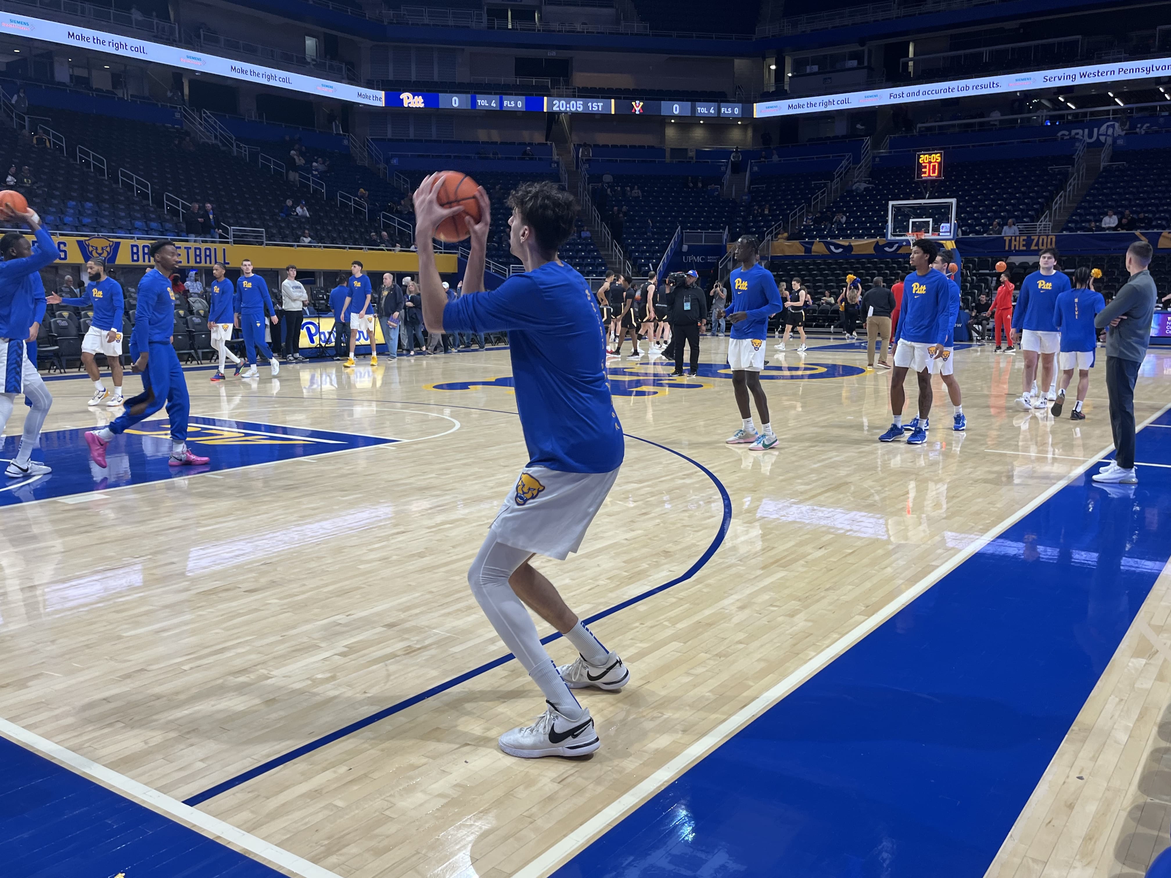 Pitt basketball player Guillermo Diaz Graham shoots a three in pregame warmups.