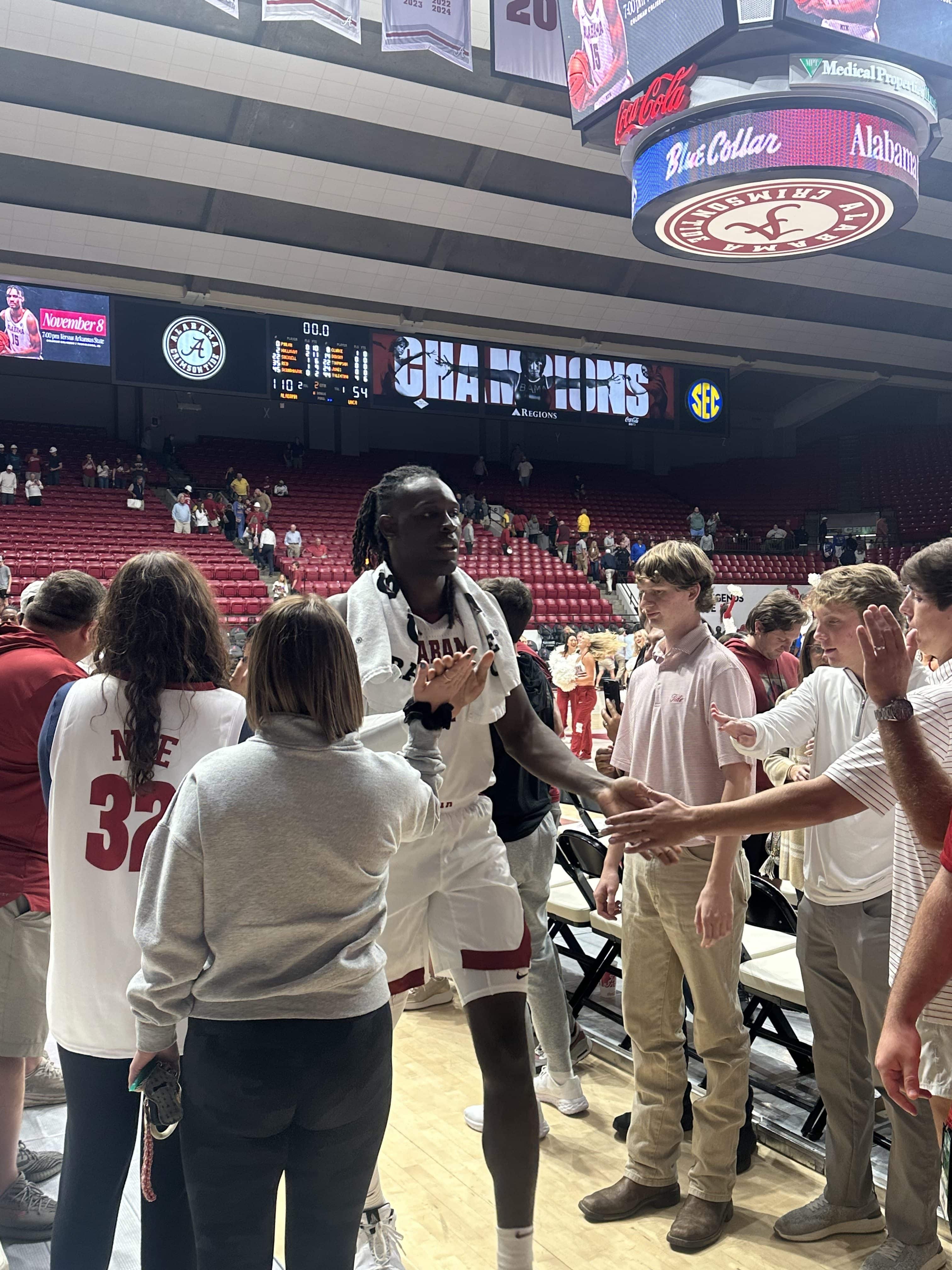 Alabama's Clifford Omoruyi celebrates win over UNC-Asheville on Monday with the fans.