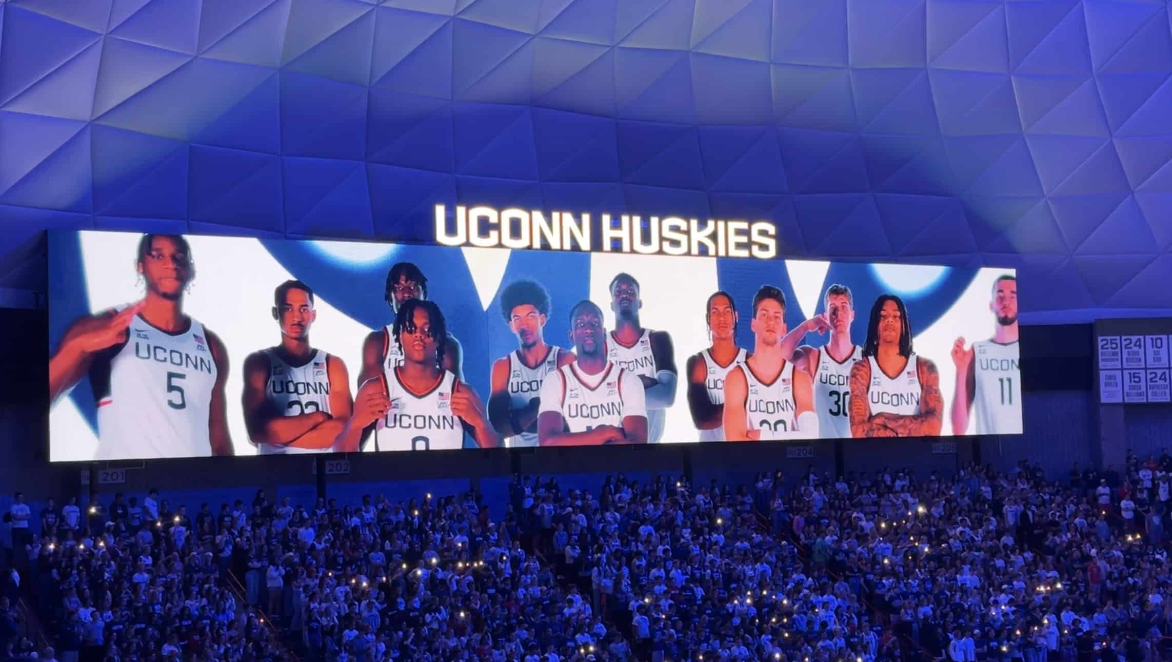 2024-25 UConn Basketball team on video board (Photo credit: Chandler Boucher, CBB Review)