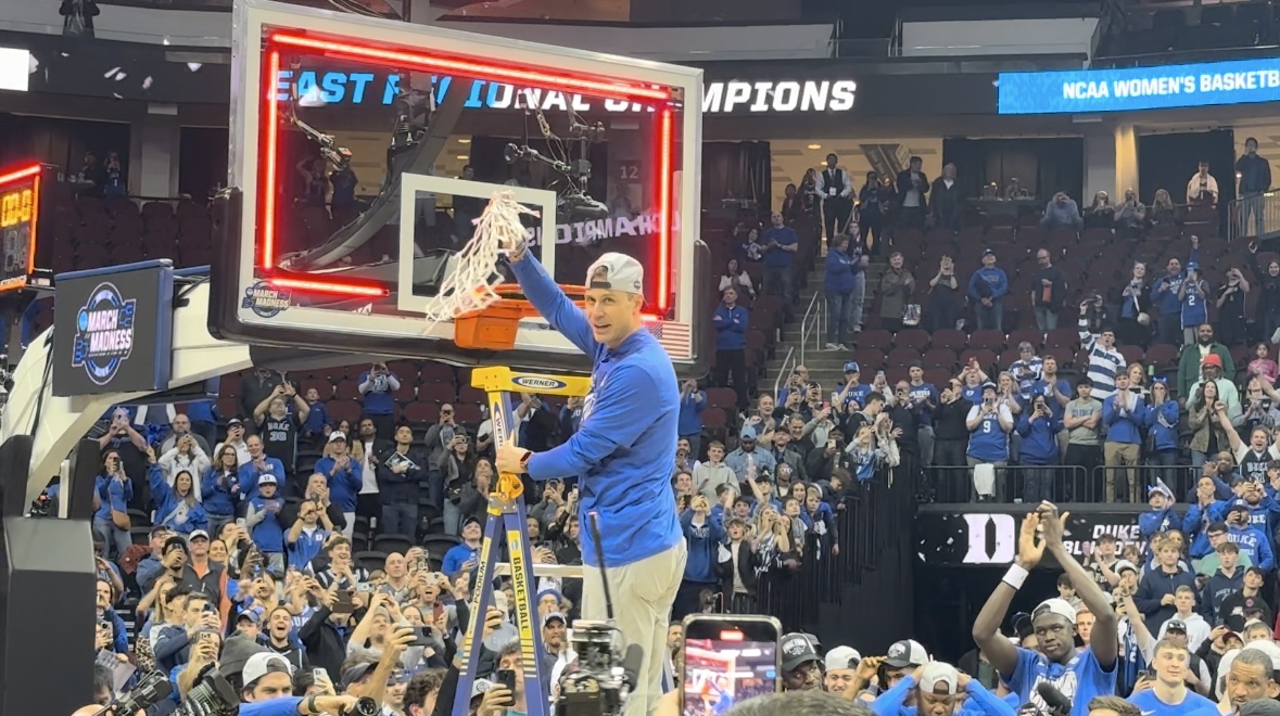 Duke Basketball's Jon Scheyer cuts the nets after advancing to the Final Four.