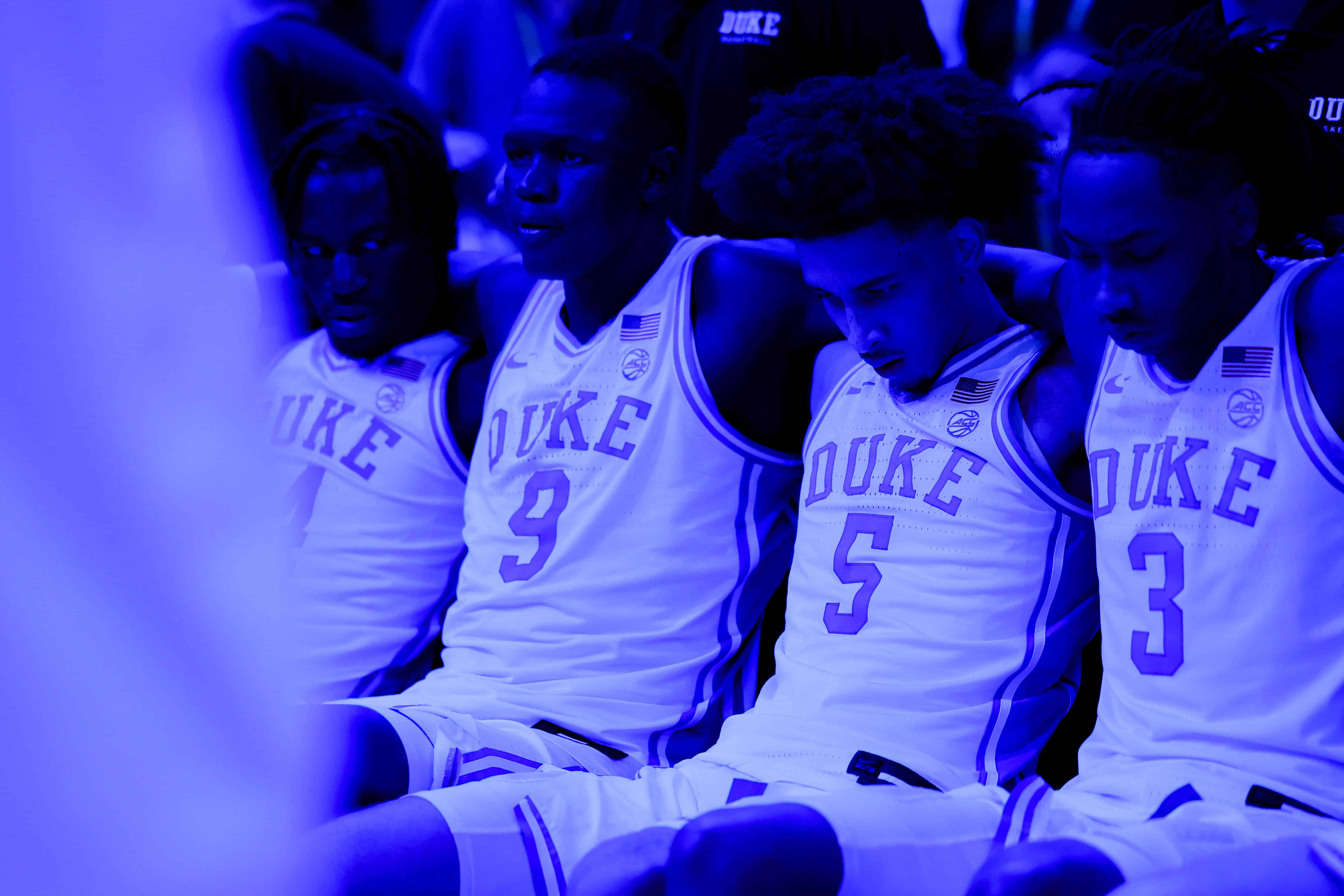 Duke basketball's starting lineup sits on the team bench during the ACC Tournament semifinals round. (Photo courtesy: ACC Communications)