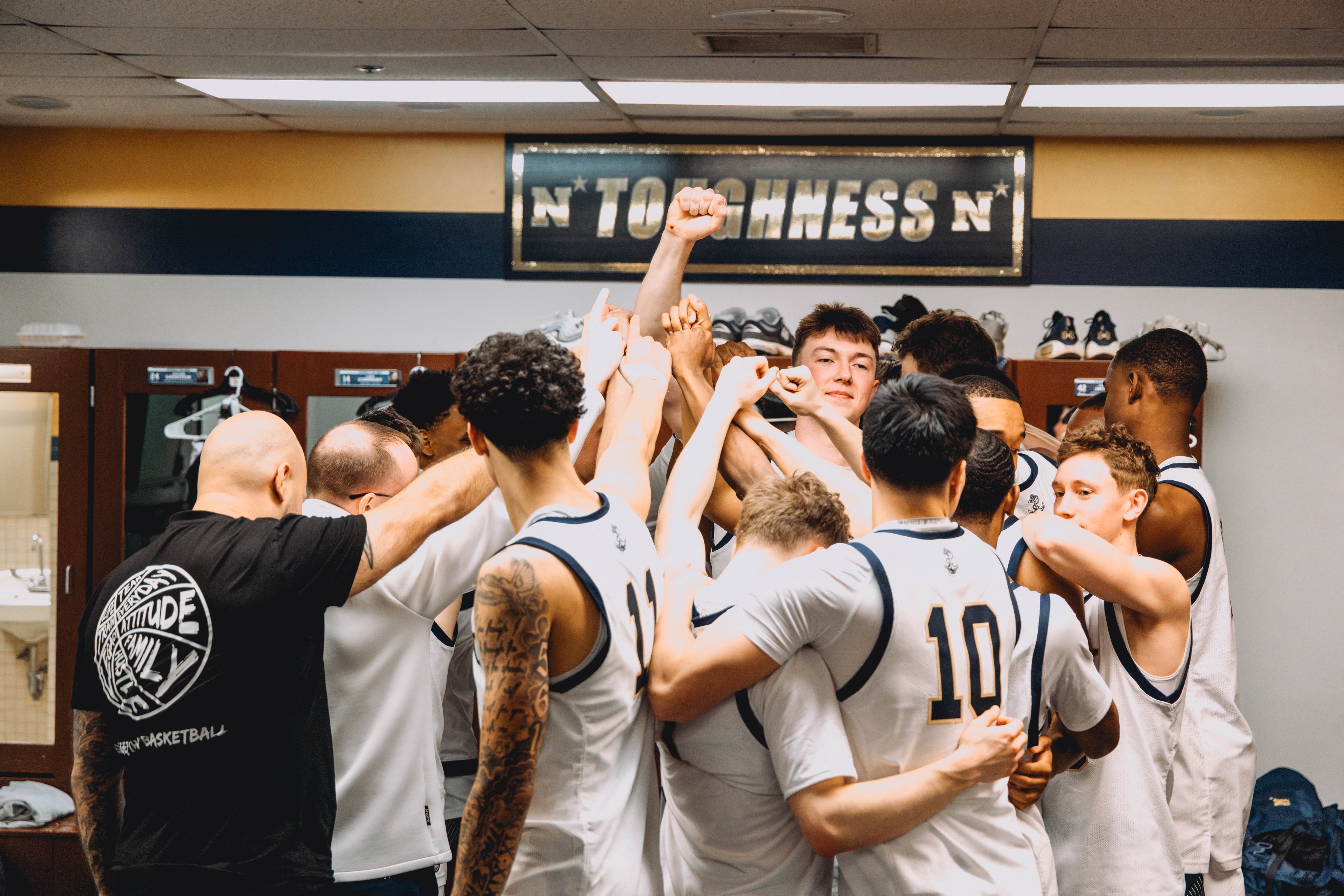 Navy basketball celebrates as College Basketball Conference Title Races heat up (Featured image via @NavyBasketball on X)